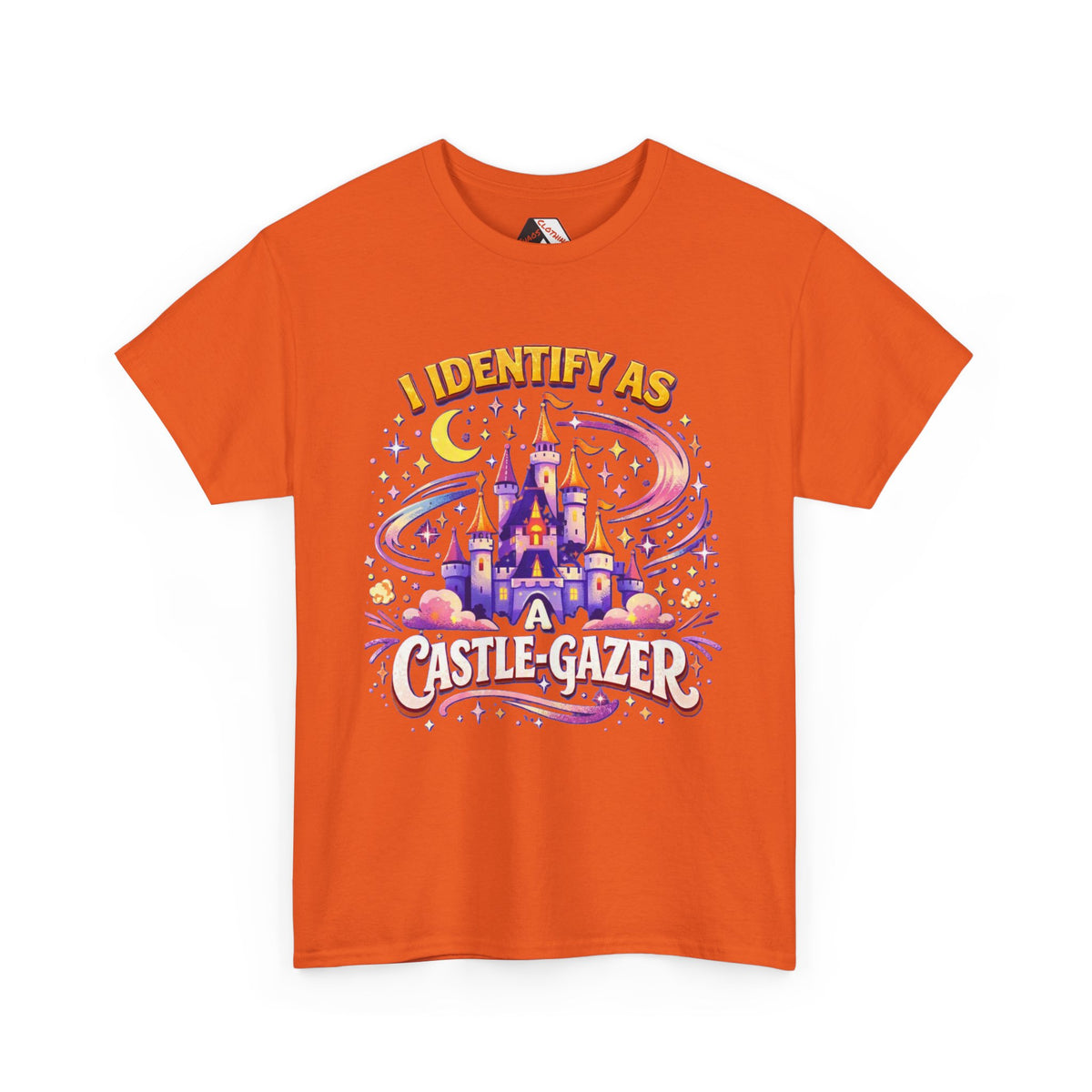 An orange short-sleeve crewneck t-shirt featuring a colorful graphic print of a castle, stars, and the text 'I IDENTIFY AS A CASTLE-GAZER'.
