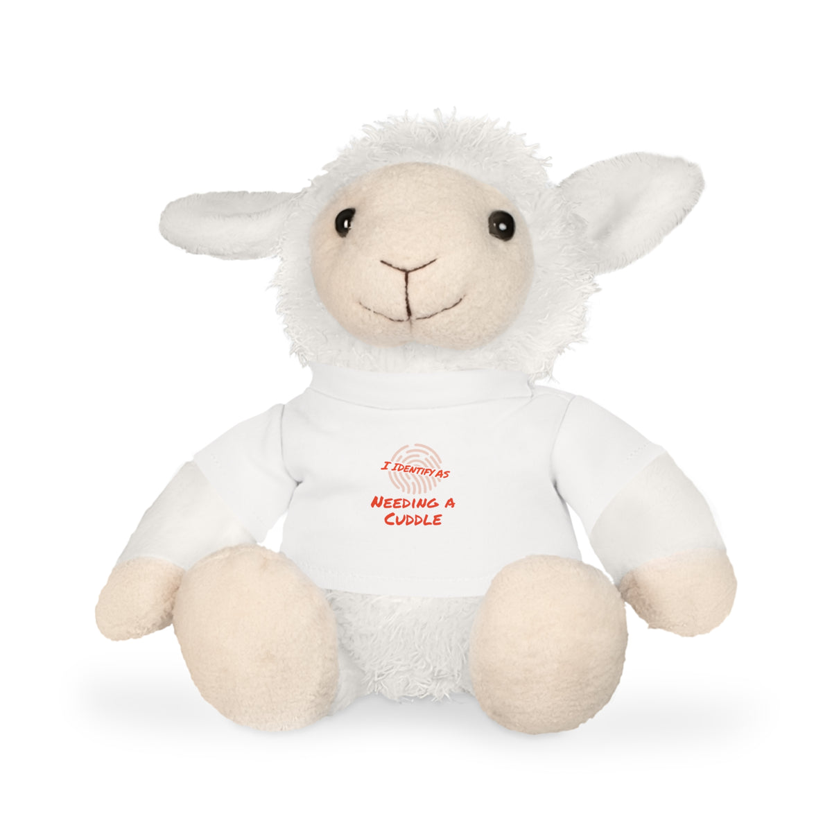 A plush white sheep toy wearing a white shirt with red text that reads 'I sometimes need a cuddle' and a small red globe graphic, photographed on a clean white background.