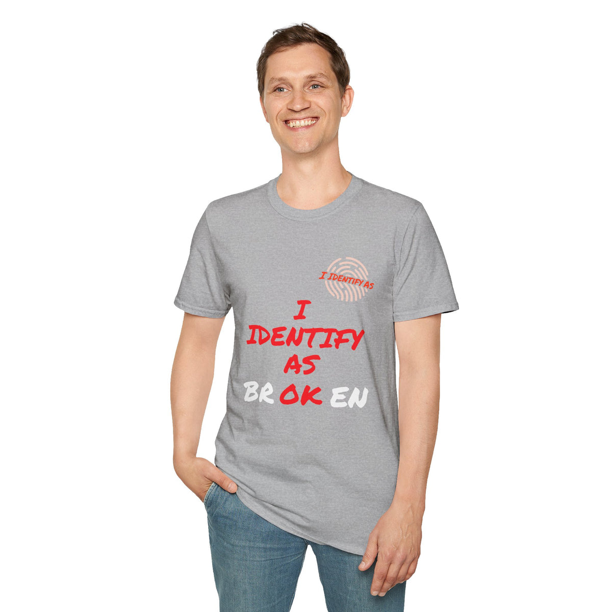 A man wearing a heather gray t-shirt with the text 'I IDENTIFY AS BROKEN' in red and white, paired with blue jeans, against a plain white background.