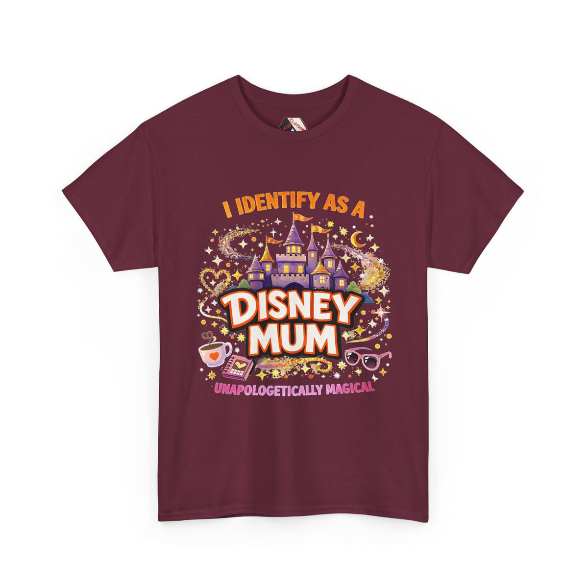 A maroon short-sleeve t-shirt with a colorful graphic print on the front that reads 'I IDENTIFY AS A DISNEY MUM' and 'UNAPOLOGETICALLY MAGICAL' with a castle and magical doodles.