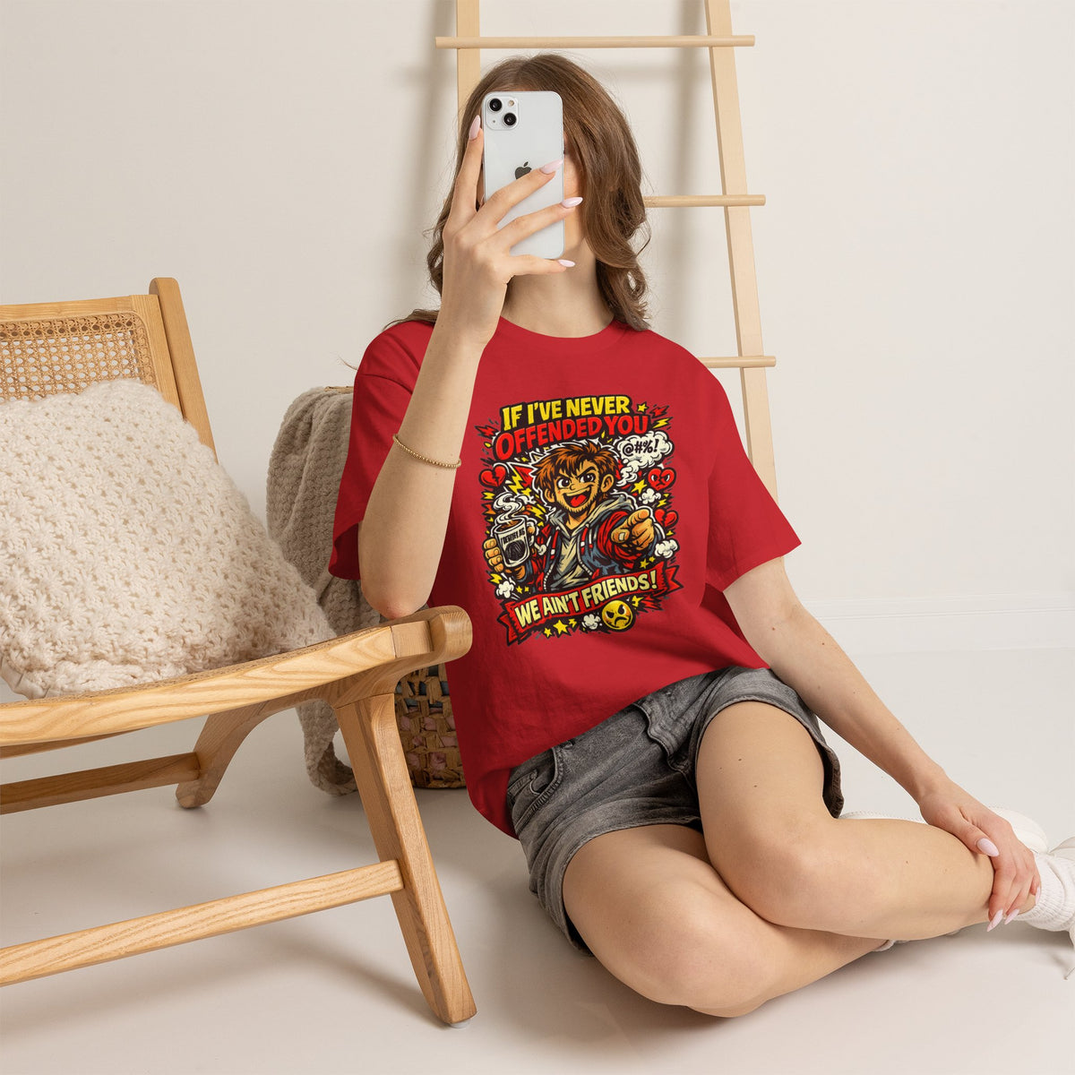 Chaos Clothing by I Identify As - Red identity‑driven humour T‑shirt with Slogan If I've Never Offended You, We Ain't Friends being worn by lady sitting on the floor