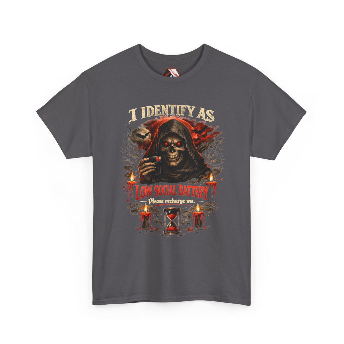 A dark gray short-sleeve t-shirt with a graphic print of a grim reaper holding a skull, with candles, an hourglass, and the text 'I IDENTIFY AS LOW SOCIAL BATTERY Please recharge me.' on a white background.