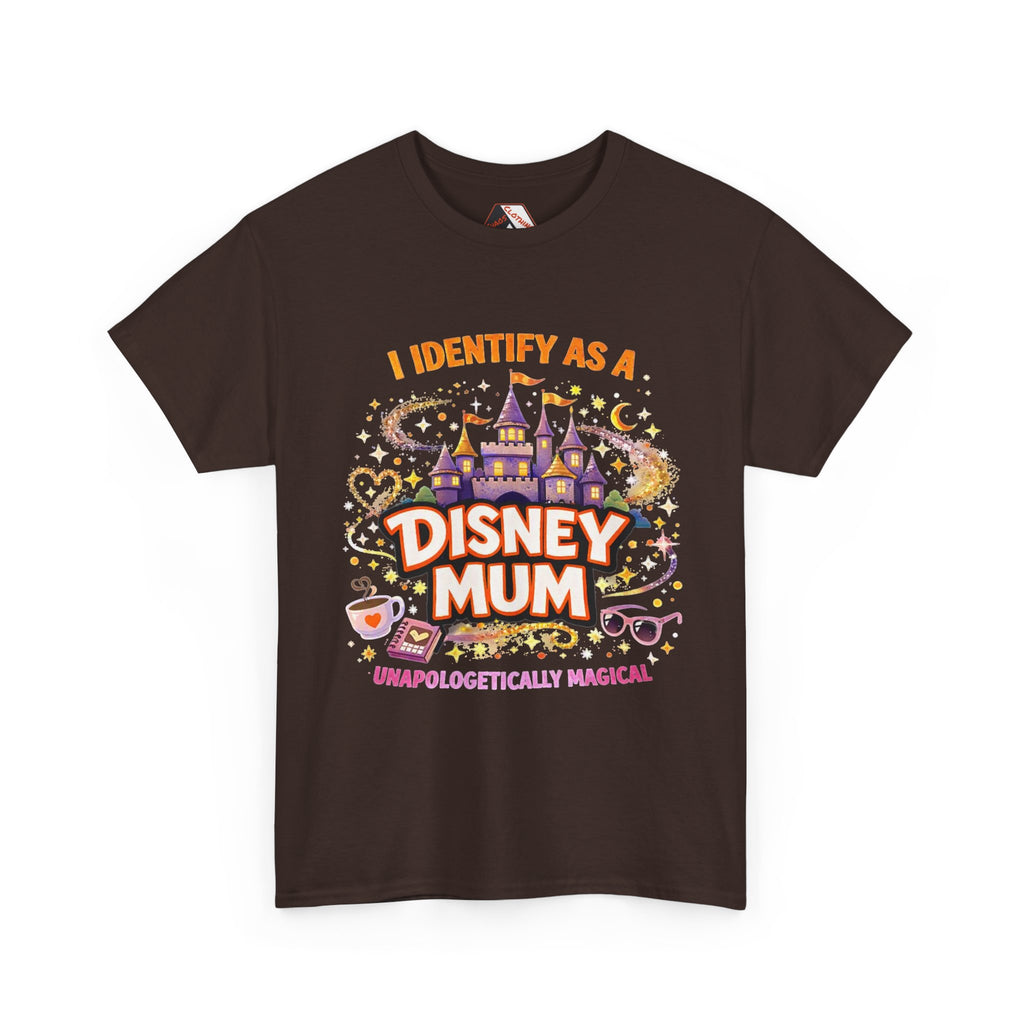 A dark brown short-sleeve t-shirt with a colorful graphic print on the front. The graphic features a purple castle, stars, a teacup, and the text 'I IDENTIFY AS A DISNEY MUM' and 'UNAPOLOGETICALLY MAGICAL'.