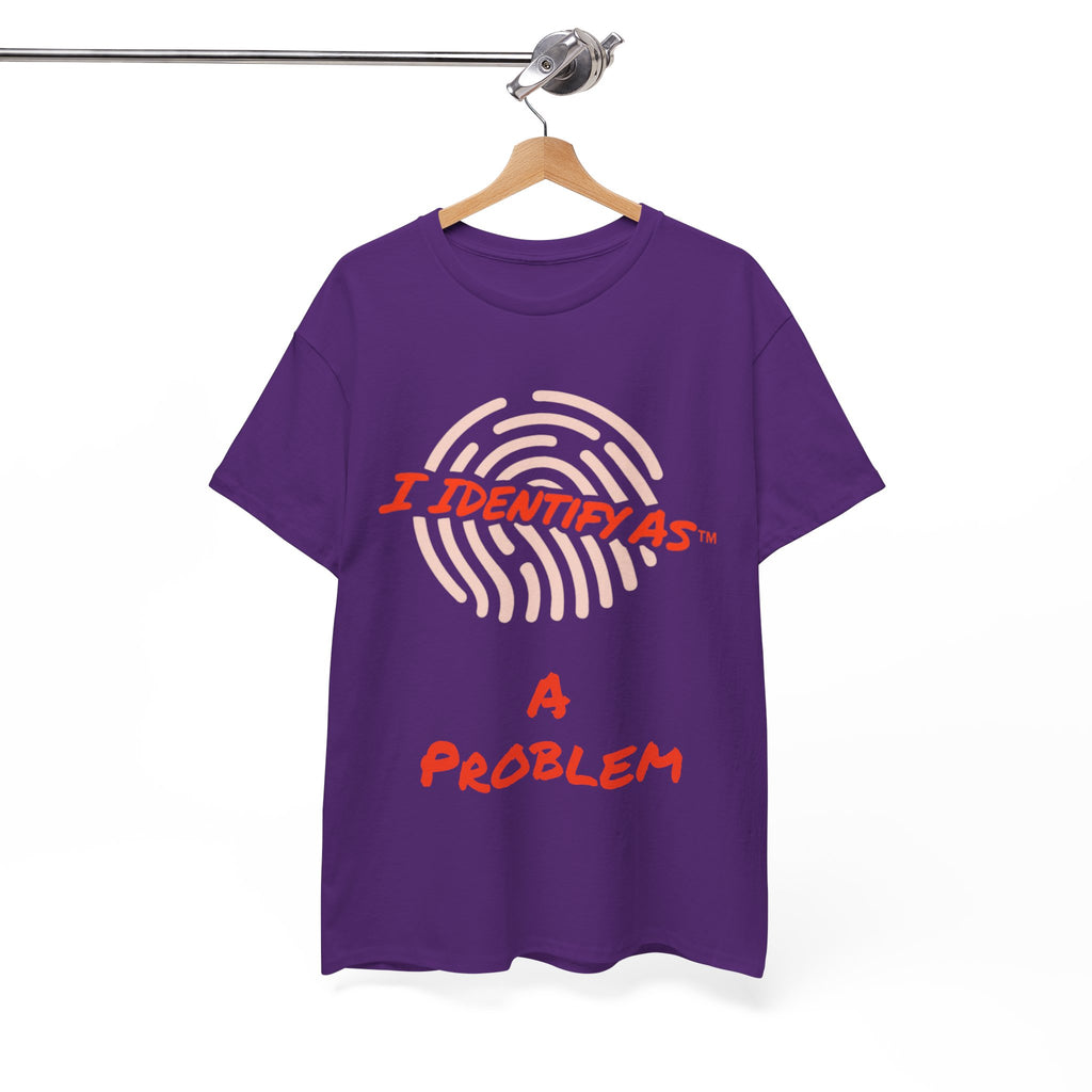 A purple short-sleeve t-shirt hanging on a wooden hanger from a metal rail, featuring a graphic print of a fingerprint with the text 'I IDENTIFY AS A PROBLEM' in red and light pink.