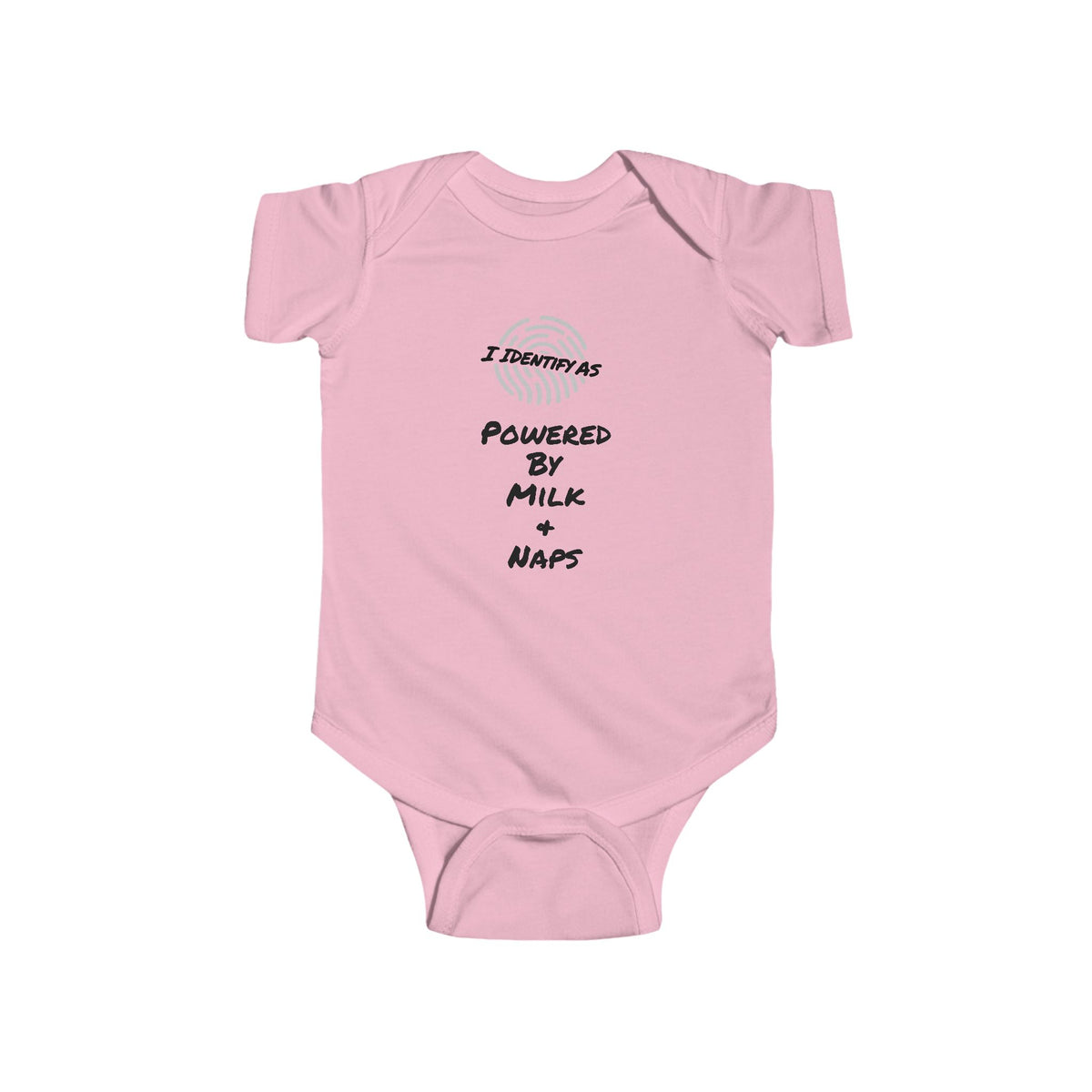 A light pink baby bodysuit with short sleeves and snap closures, featuring a graphic print on the chest that reads 'I IDENTIFY AS POWERED BY MILK + NAPS' in black text with a small circular logo above it, displayed on a solid white background.