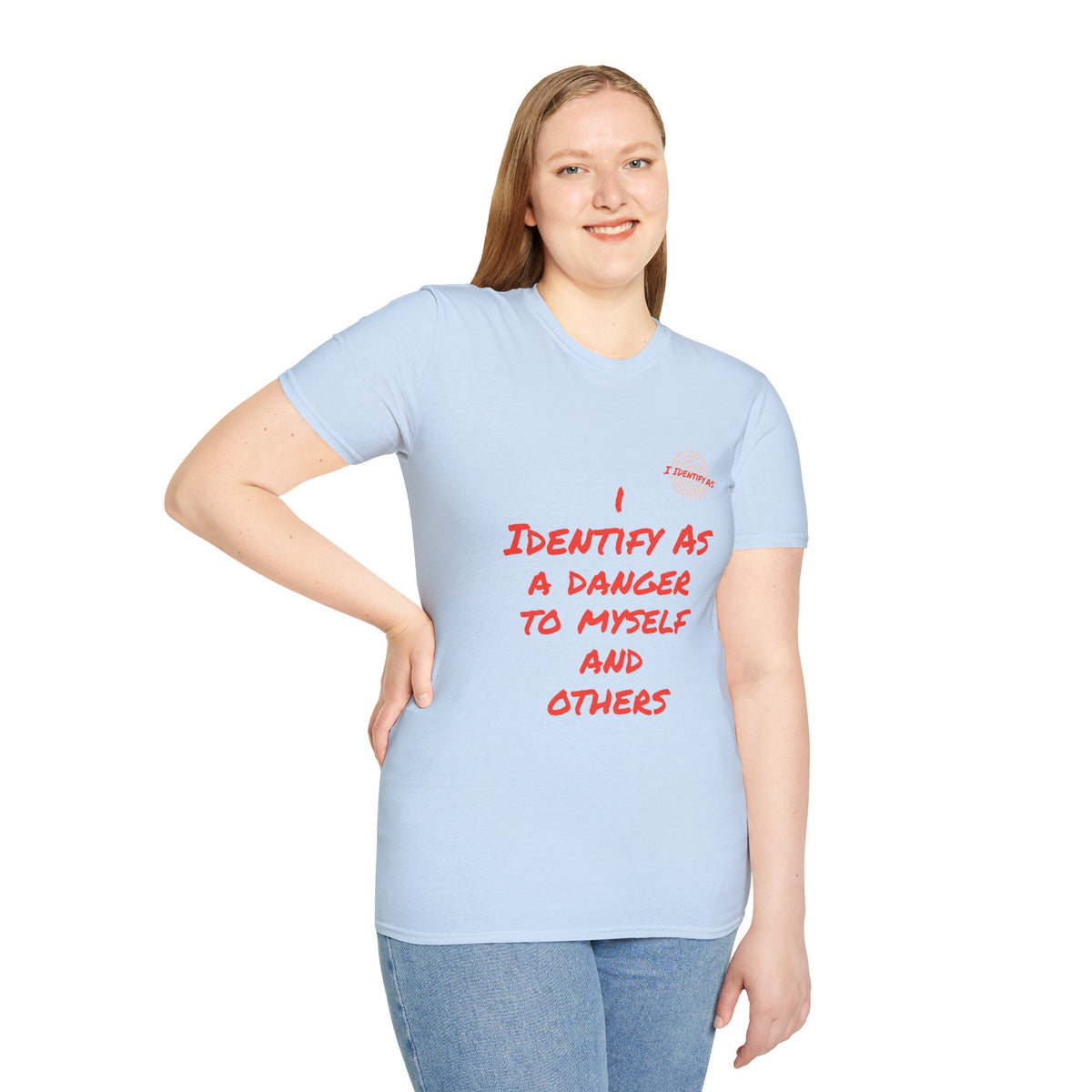 A woman modeling a light blue t-shirt with red text that reads 'I IDENTIFY AS A DANGER TO MYSELF AND OTHERS’ in a bold stacked font, with the I Identify As™ circular fingerprint logo printed above the text on the left chest.