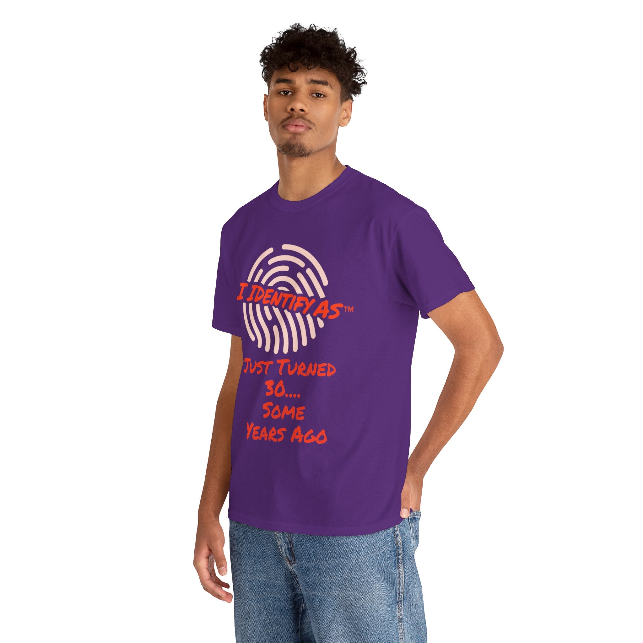 A man wearing a purple t-shirt with a white fingerprint graphic and red text that reads  JUST TURNED 30.