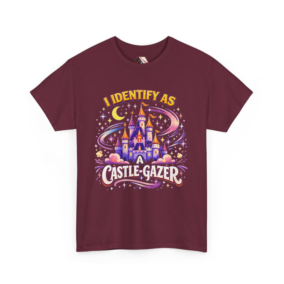 A maroon short-sleeve t-shirt with a colorful graphic on the front featuring a castle, stars, a crescent moon, and the text 'I IDENTIFY AS A CASTLE-GAZER'.