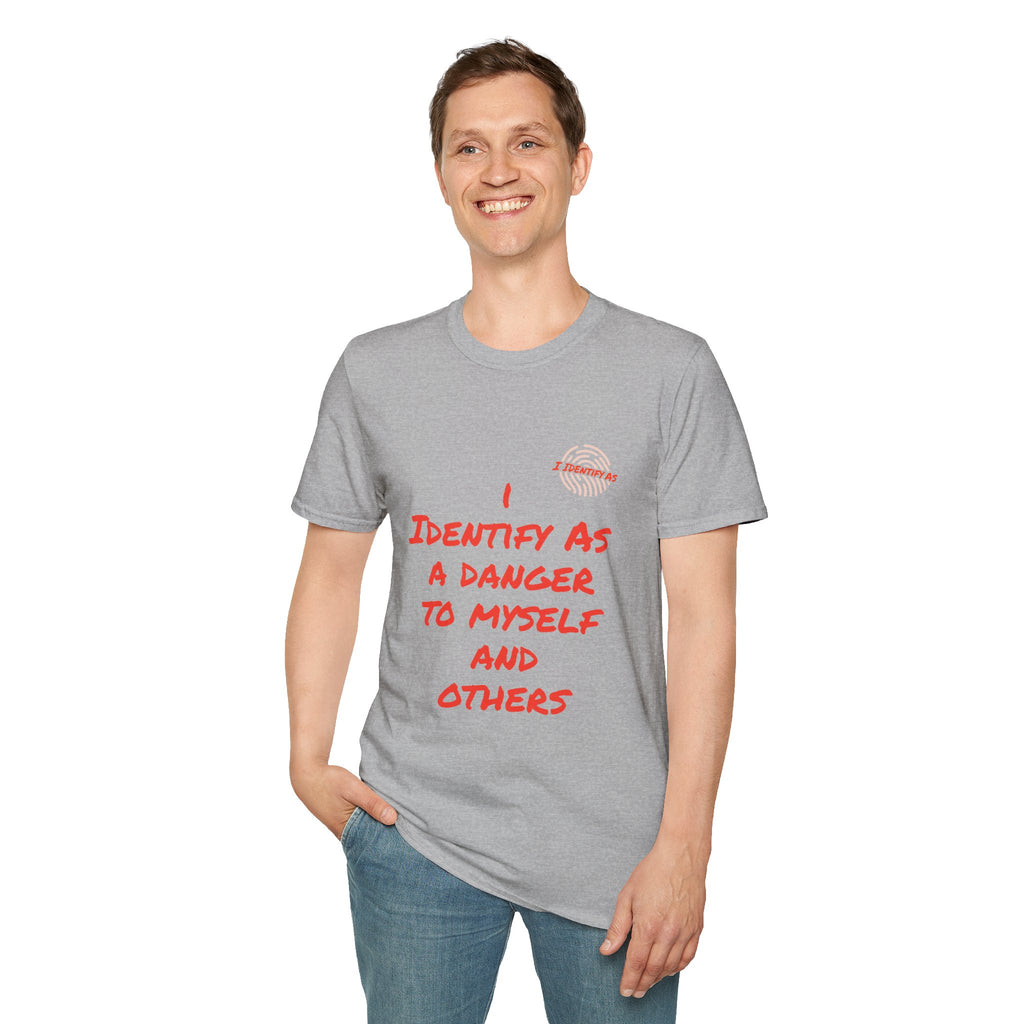 A man wearing a heather gray t-shirt with red text that reads 'I IDENTIFY AS A DANGER TO MYSELF AND OTHERS’ in a bold stacked font, with the I Identify As™ circular fingerprint logo printed above the text on the left chest.