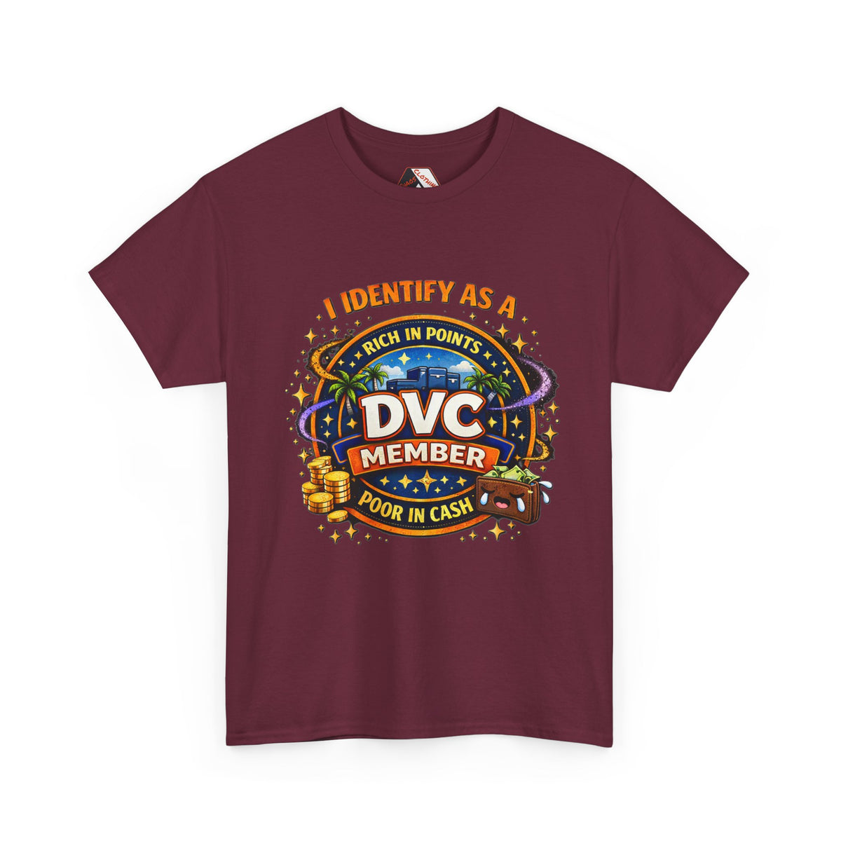 A maroon short-sleeve crewneck t-shirt with a colorful graphic print on the front. The graphic features a parody design that reads 'I IDENTIFY AS A DVC MEMBER RICH IN POINTS POOR IN CASH' with a casino-themed illustration including a slot machine, gold coins, and a roulette wheel.