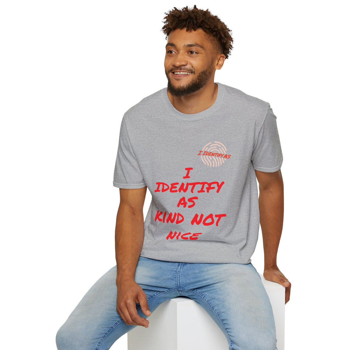 Man wearing a grey slogan t-shirt that reads I Identify As Kind Not Nice in red text.