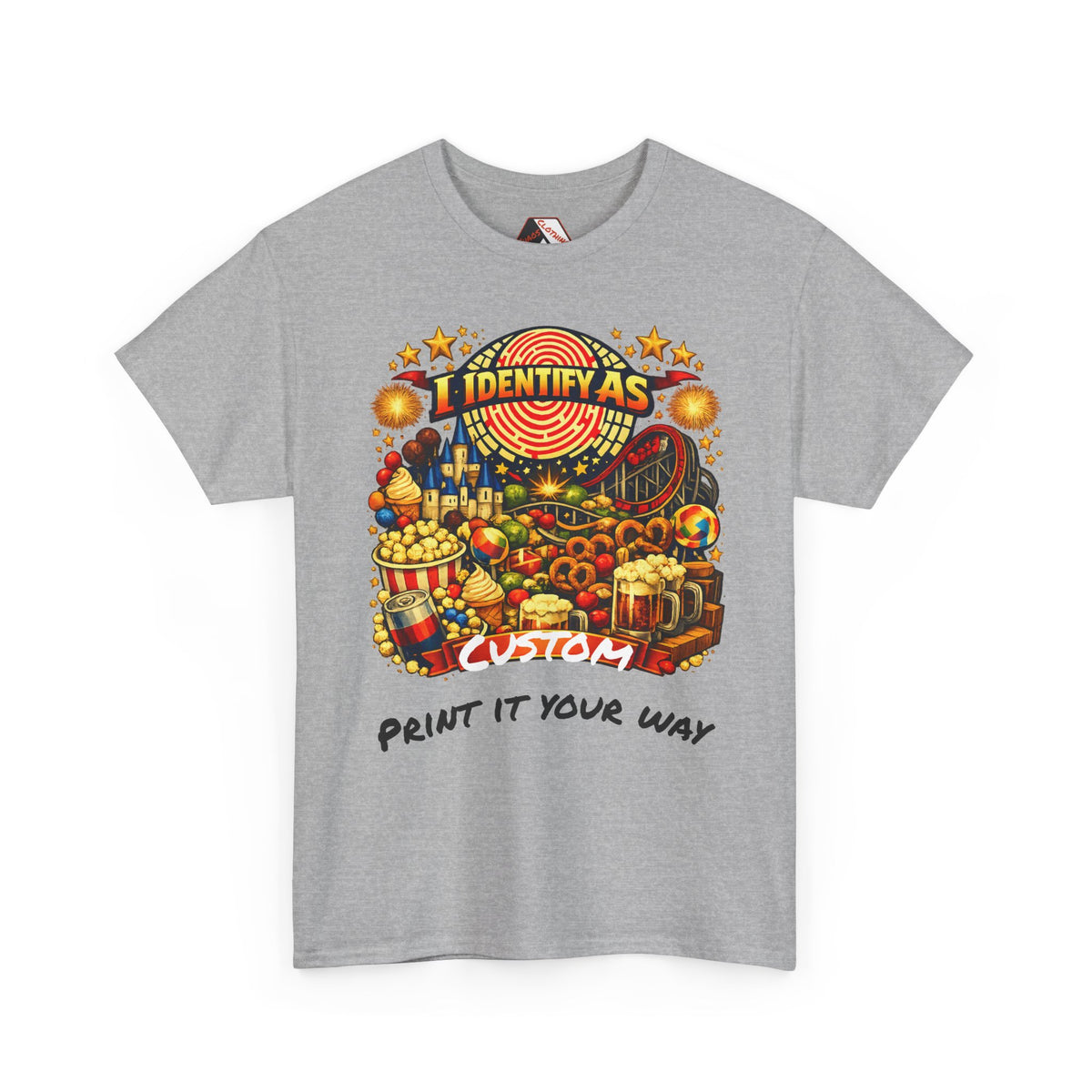 A heather gray short-sleeve t-shirt with a colorful graphic print on the front. The graphic features a carnival-themed illustration with the text 'I IDENTIFY AS' above a carnival scene and 'CUSTOM' below, with 'PRINT IT YOUR WAY' printed underneath in black script.