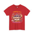 A red short-sleeve crewneck t-shirt featuring a colorful graphic print on the front with the text 'I IDENTIFY AS A DISNEY MUM' and 'UNAPOLOGETICALLY MAGICAL' surrounded by cartoon castle, stars, and themed icons.