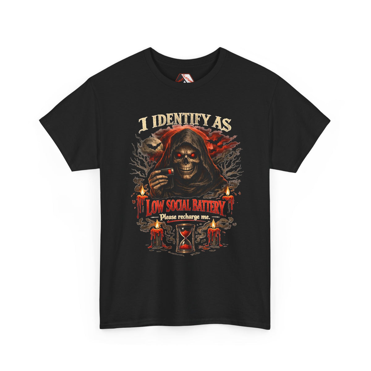 A black short-sleeve t-shirt with a detailed graphic print on the front. The graphic features a hooded grim reaper with glowing red eyes, candles, an hourglass, and the text 'I IDENTIFY AS LOW SOCIAL BATTERY Please recharge me.