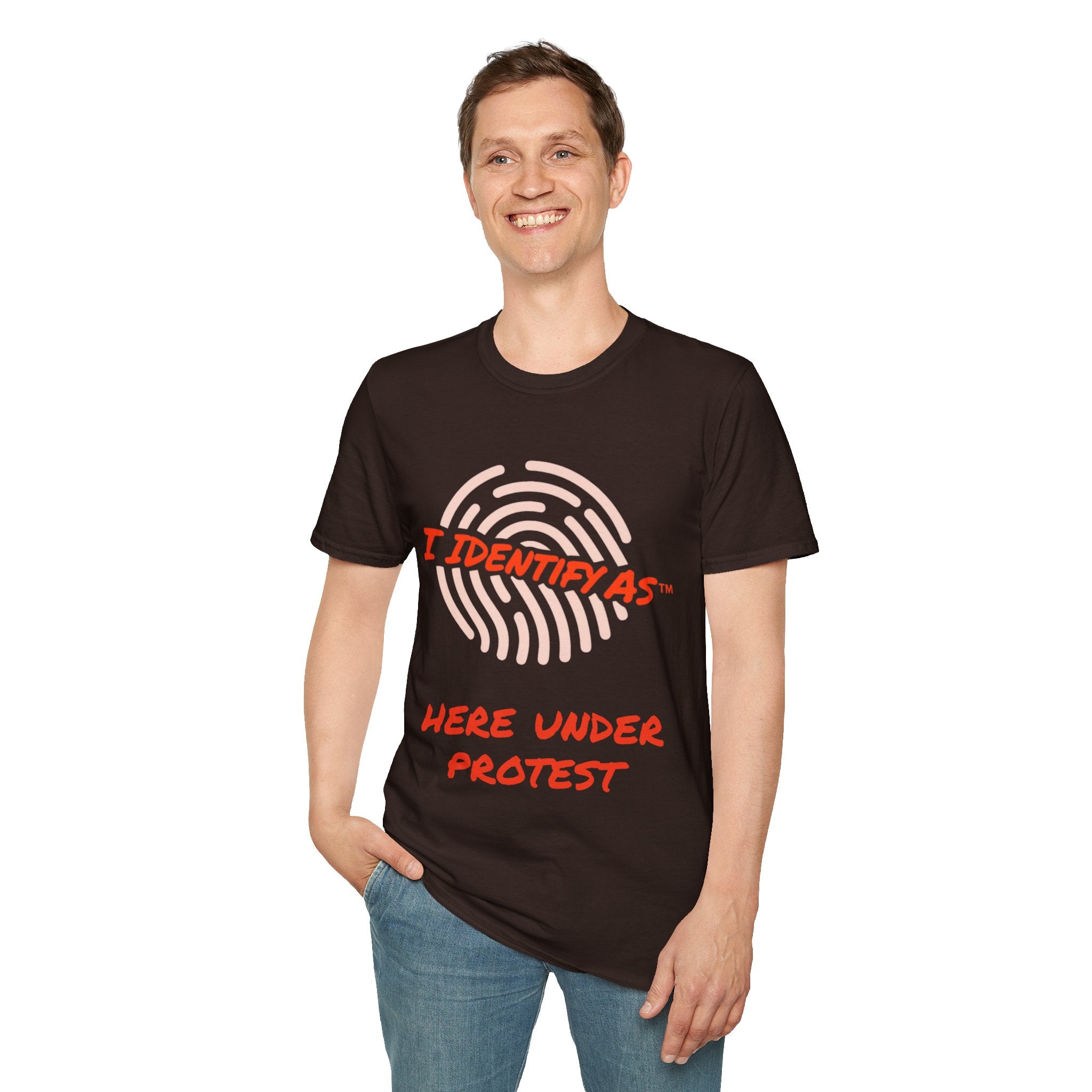 A man wearing a dark brown t-shirt with a graphic print that reads 'I IDENTIFY AS' above a white fingerprint design and 'HERE UNDER PROTEST' in red text, paired with blue jeans against a plain white background. Funny T Shirt