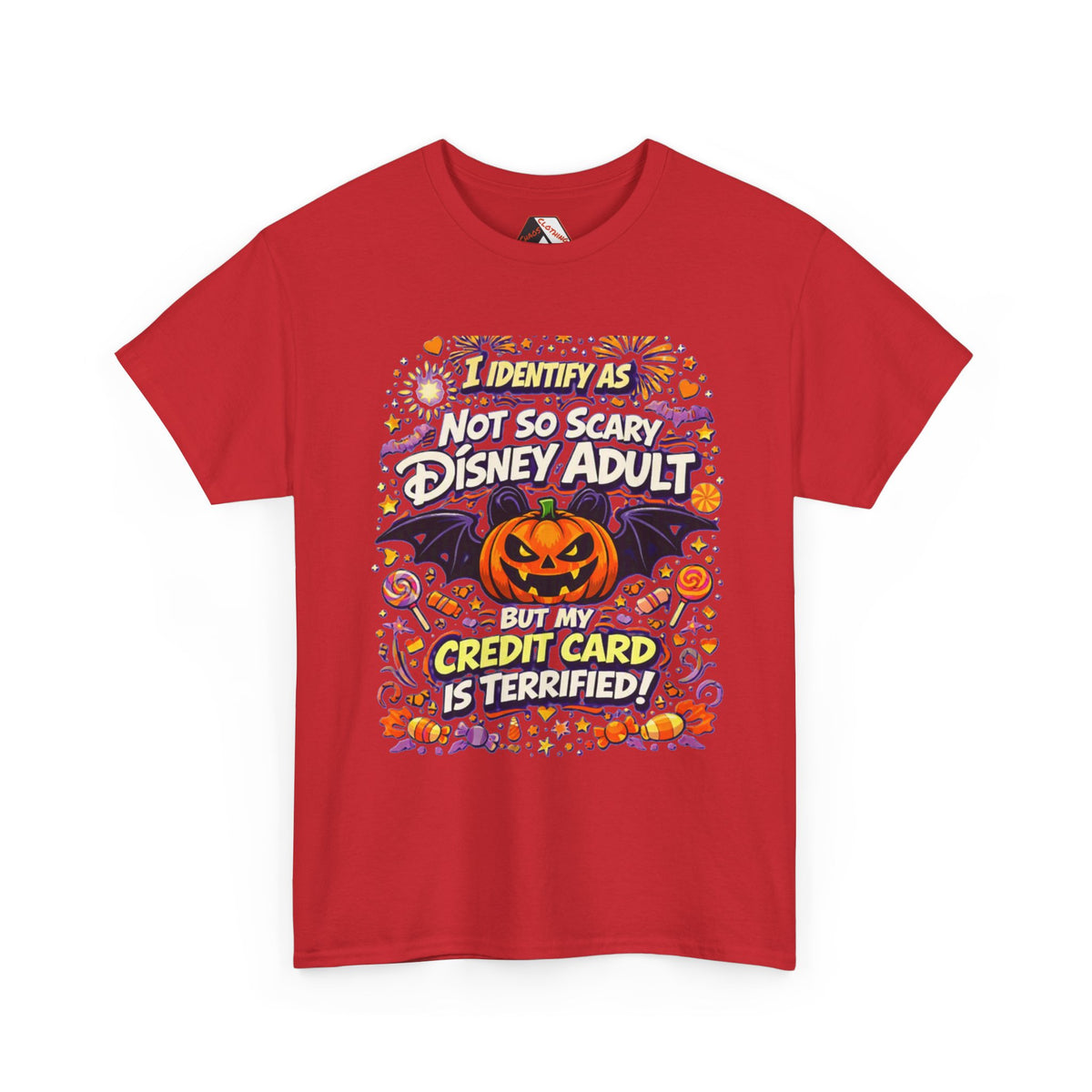 A red short-sleeve crewneck t-shirt with a colorful graphic print on the front. The graphic features a jack-o'-lantern, bats, and Halloween-themed text that reads 'I IDENTIFY AS NOT SO SCARY DISNEY ADULT BUT MY CREDIT CARD IS TERRIFIED!'.