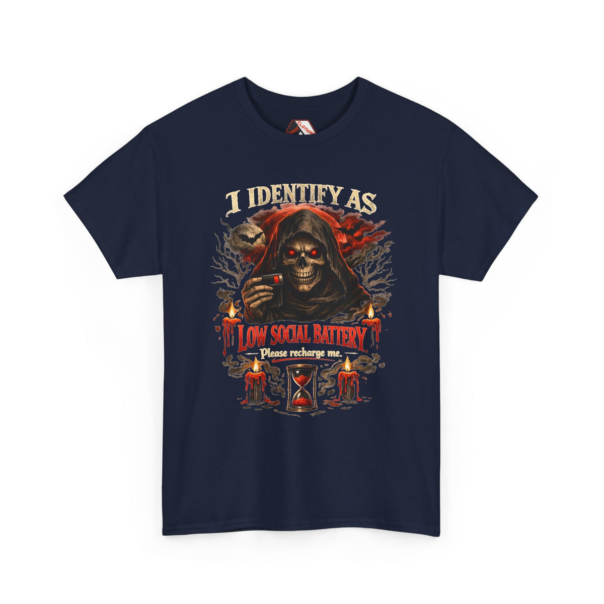A navy blue short-sleeve t-shirt with a detailed graphic print on the front. The graphic features a dark hooded figure with glowing red eyes, candles, an hourglass, and the text 'I IDENTIFY AS A LOW SOCIAL BATTERY Please recharge me.